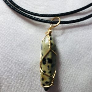 WIRE WRAPPED DALMATIAN JASPER PENDANT.
